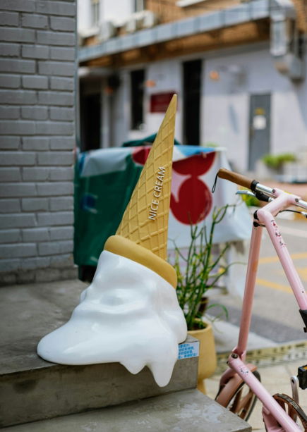 Giant ice cream cone sculpture on display.