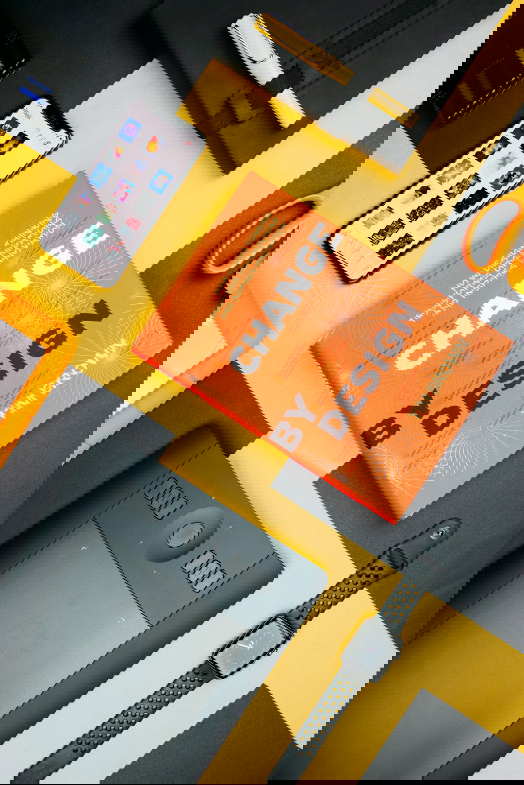 Change by Design by Tim Brown book beside smartphone